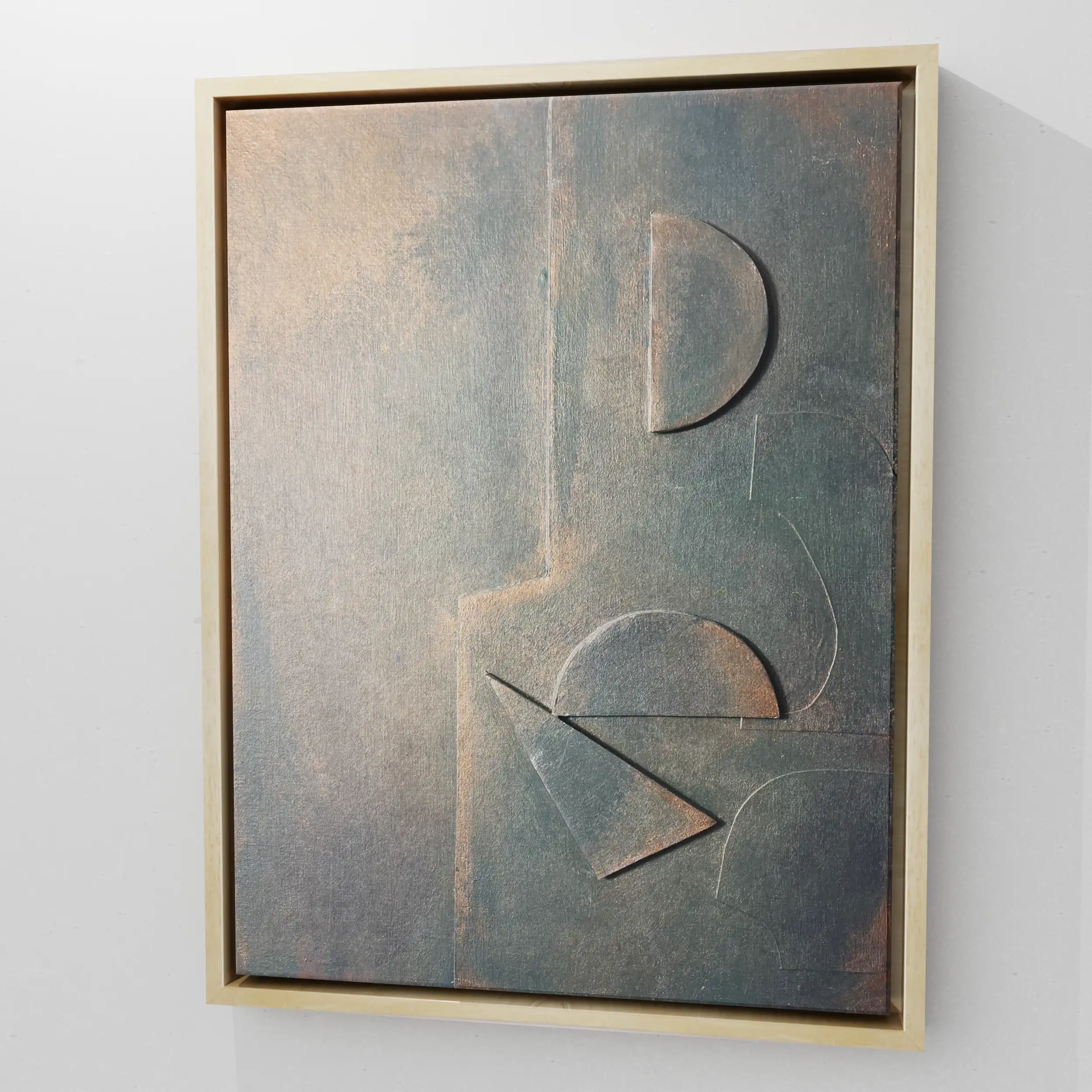Vertical relief panel: empty beige left half, blue-grey right half with raised semi-circle, circle, triangle forms